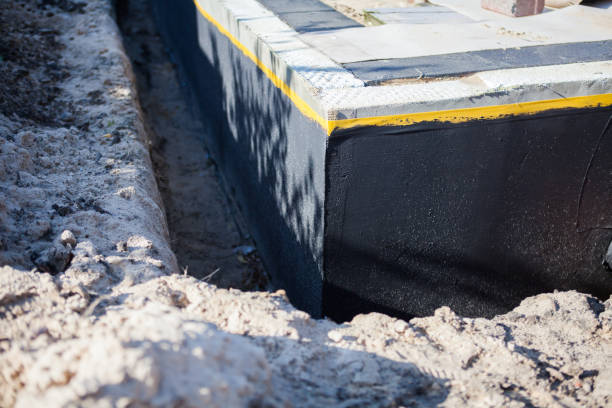 Professional Waterproofing technician working in Bellevue, KY